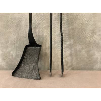 A blackened iron chimney with a shovel and a clamp 18 th