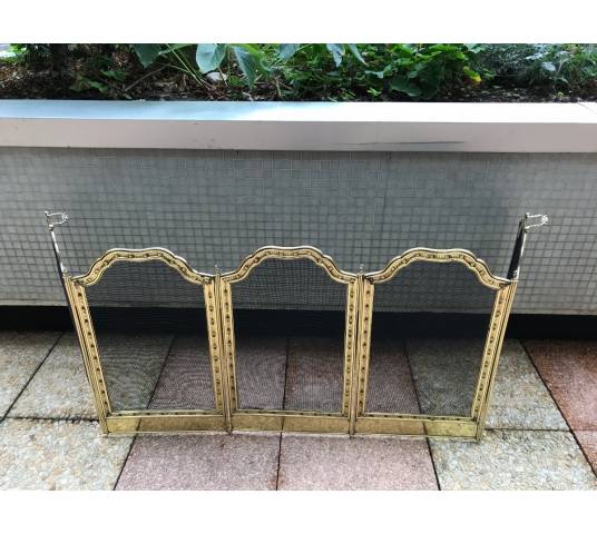 Large firewalls of old fireplace in polished brass and period varnish 19 th