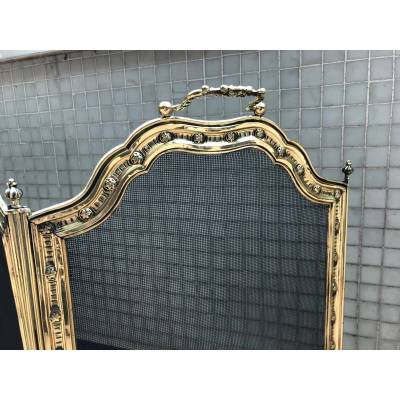 Large firewalls of old fireplace in polished brass and period varnish 19 th