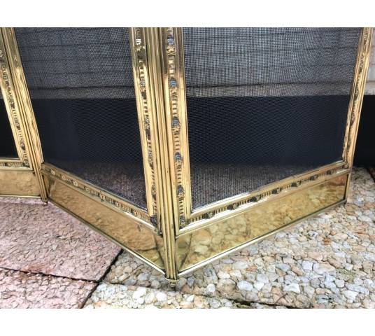 Large firewalls of old fireplace in polished brass and period varnish 19 th
