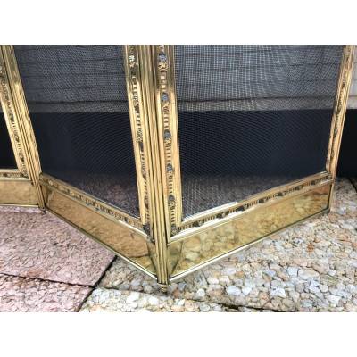 Large firewalls of old fireplace in polished brass and period varnish 19 th