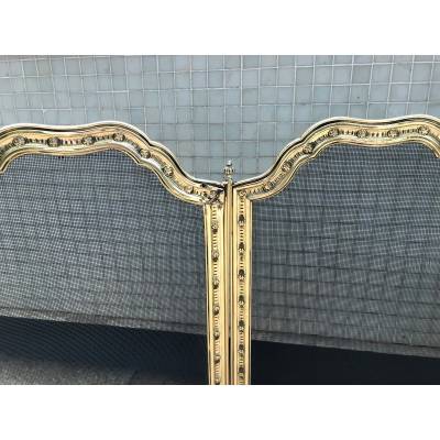 Large firewalls of old fireplace in polished brass and period varnish 19 th