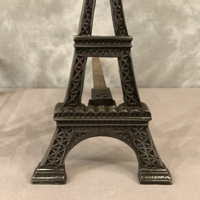 Ancient channels in polished cast iron around 1900 representing the Eiffel Tower