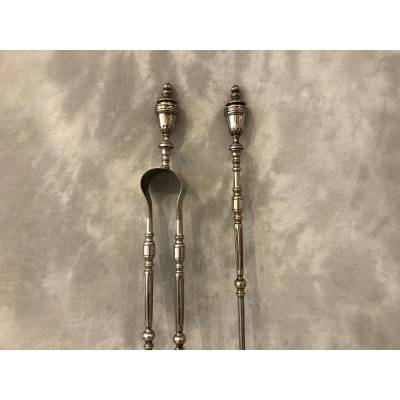 Beautiful chimney set with a shovel and an iron clamp and silver bronze of epoch 19 th