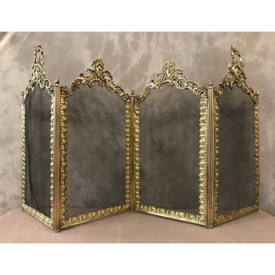 Beautiful old fireplace firewall in bronze and brass from the 19th century