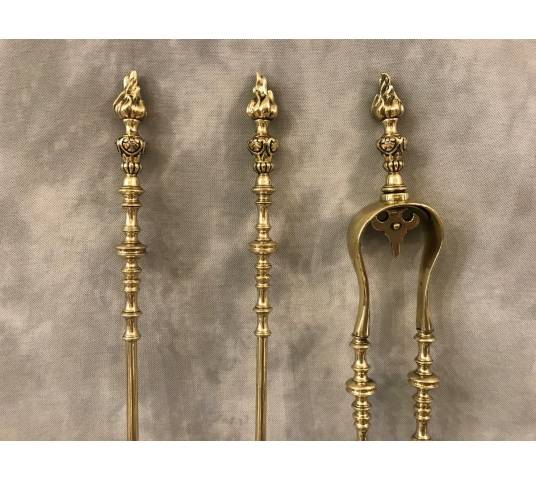 Set of 3 pieces of bronze and brass fireplace accessories from the 19th century