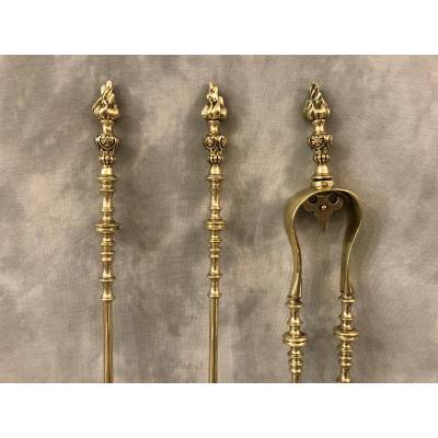 Set of 3 pieces of bronze and brass fireplace accessories from the 19th century