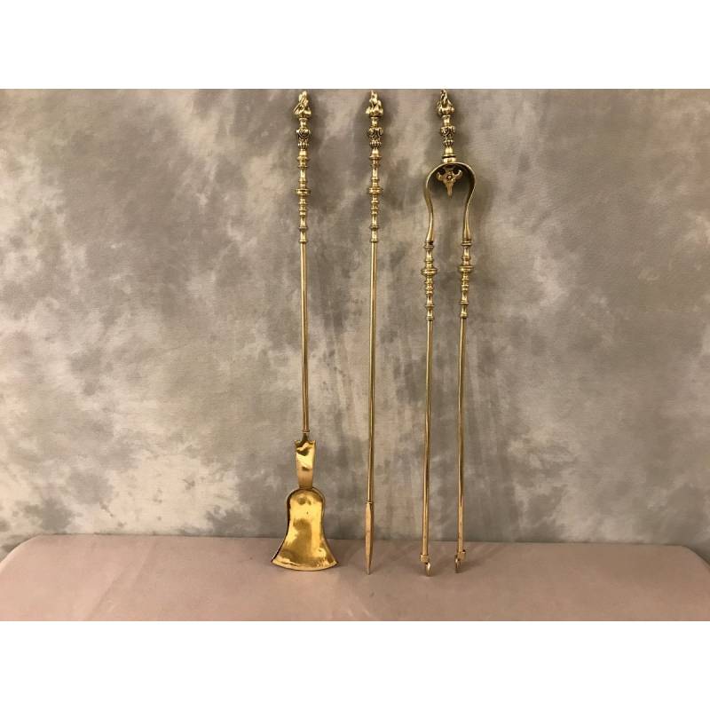 Set of 3 pieces of bronze and brass fireplace accessories from the 19th century