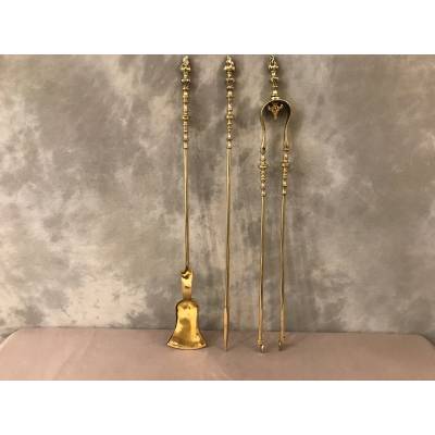 Set of 3 pieces of bronze and brass fireplace accessories from the 19th century