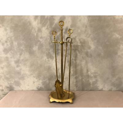 Old brass fireplace servant from the 19th century