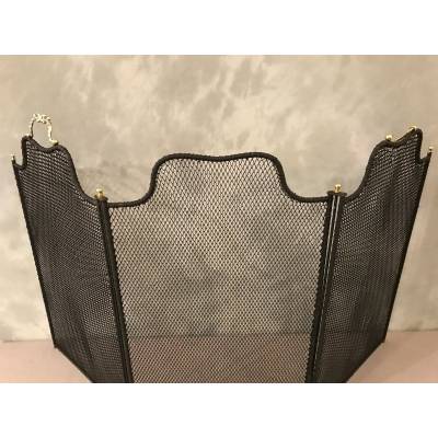 Old blackened iron fireplace firewall from the 19th century