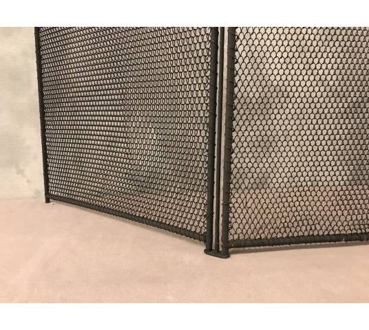 Old blackened iron fireplace firewall from the 19th century