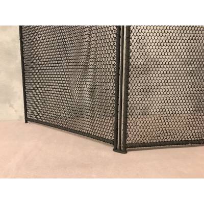 Old blackened iron fireplace firewall from the 19th century