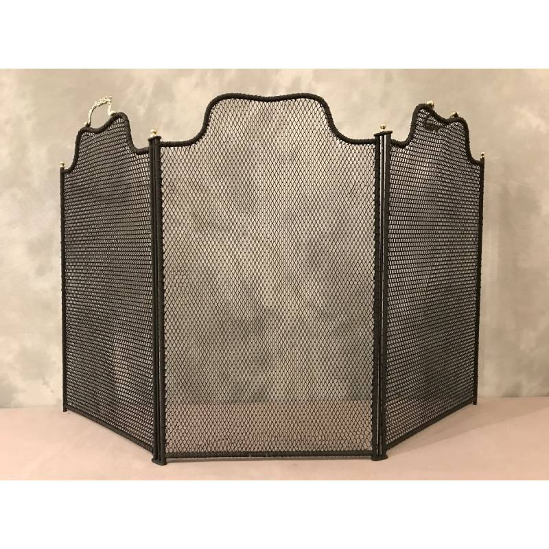 Old blackened iron fireplace firewall from the 19th century