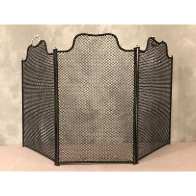 Old blackened iron fireplace firewall from the 19th century