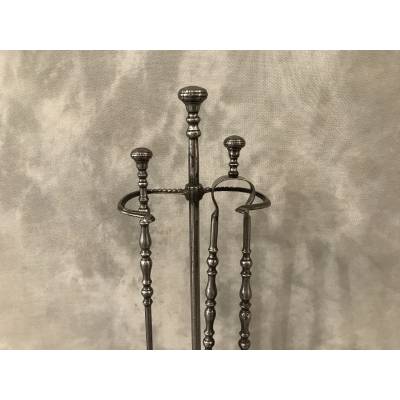 Old iron fireplace servant with shoveled 19th century clamp