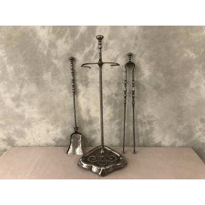Old iron fireplace servant with shoveled 19th century clamp