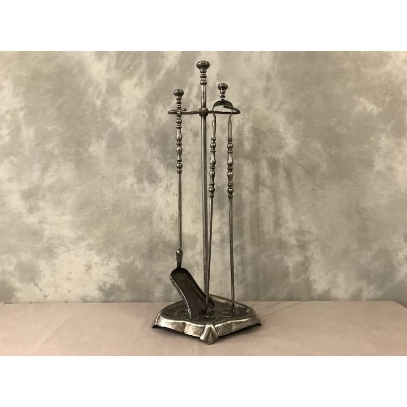 Old iron fireplace servant with shoveled 19th century clamp