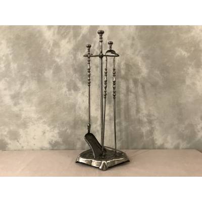 Old iron fireplace servant with shoveled 19th century clamp