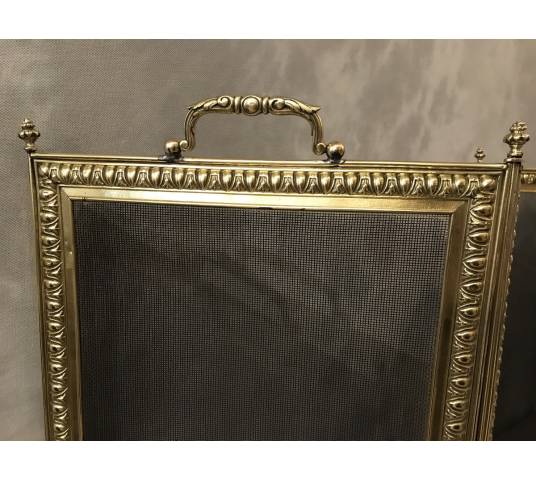 Old fireplace firewall in pressed brass from the 19th century