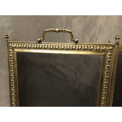 Old fireplace firewall in pressed brass from the 19th century