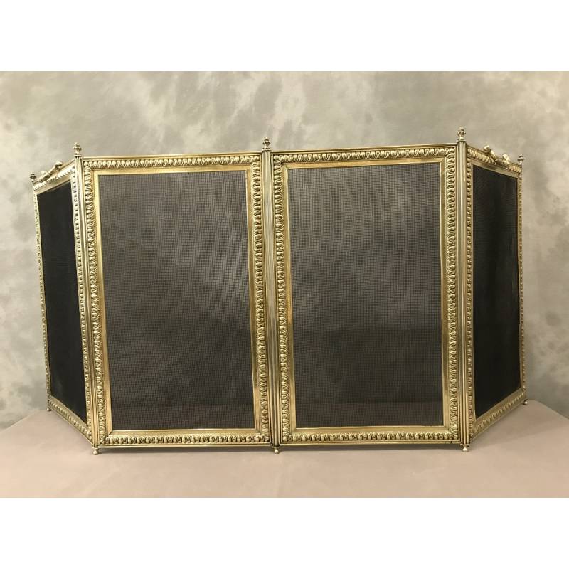 Old fireplace firewall in pressed brass from the 19th century