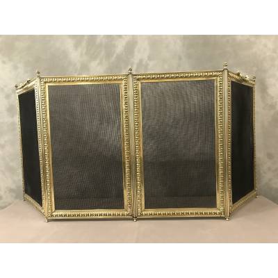 Old fireplace firewall in pressed brass from the 19th century