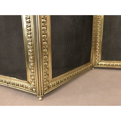 Old fireplace firewall in pressed brass from the 19th century
