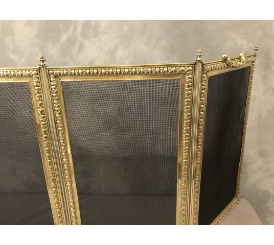 Old fireplace firewall in pressed brass from the 19th century