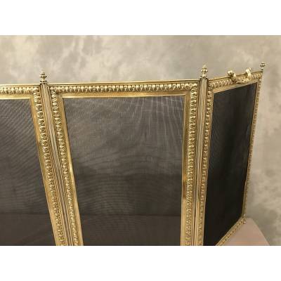 Old fireplace firewall in pressed brass from the 19th century