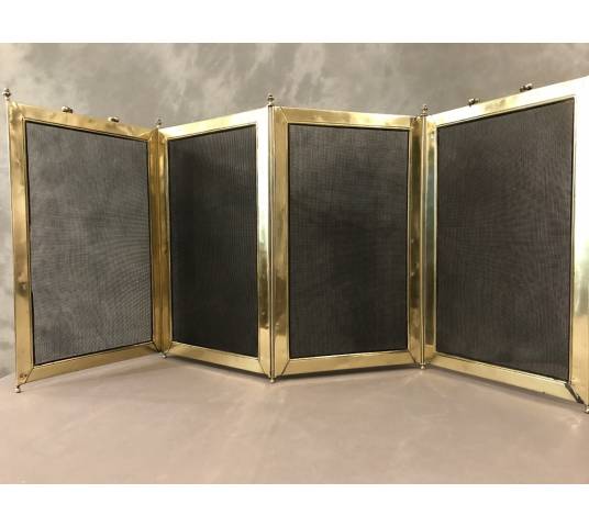 Old fireplace firewall in pressed brass from the 19th century