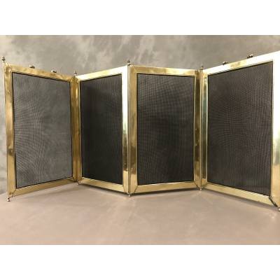 Old fireplace firewall in pressed brass from the 19th century