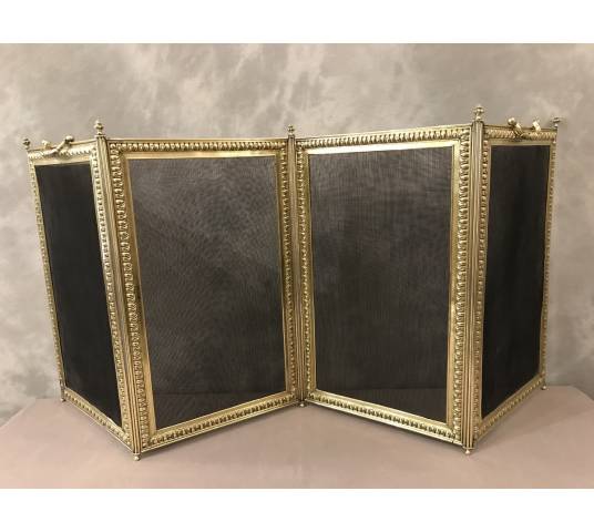 Old fireplace firewall in pressed brass from the 19th century