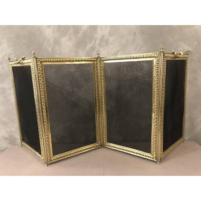 Old fireplace firewall in pressed brass from the 19th century