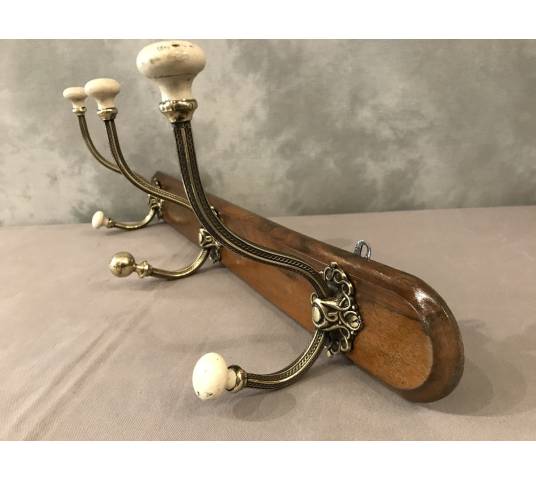 Brass and ceramic coat rack bar from the late 19th century