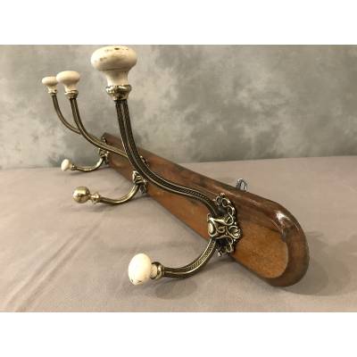 Brass and ceramic coat rack bar from the late 19th century