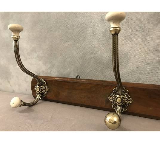 Brass and ceramic coat rack bar from the late 19th century