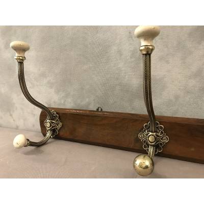 Brass and ceramic coat rack bar from the late 19th century
