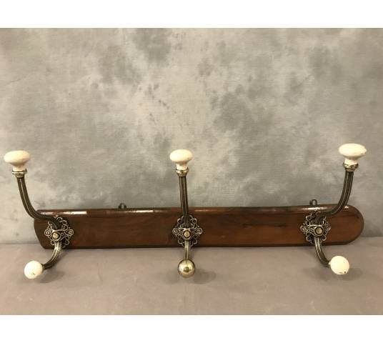 Brass and ceramic coat rack bar from the late 19th century
