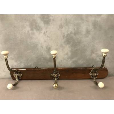 Brass and ceramic coat rack bar from the late 19th century