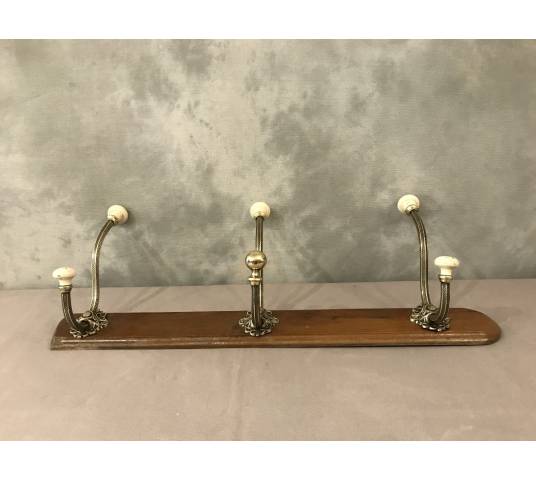 Brass and ceramic coat rack bar from the late 19th century