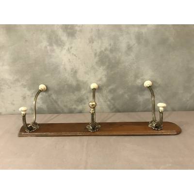 Brass and ceramic coat rack bar from the late 19th century