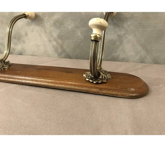 Brass and ceramic coat rack bar from the late 19th century