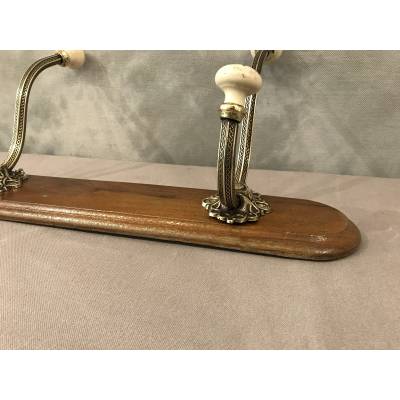 Brass and ceramic coat rack bar from the late 19th century