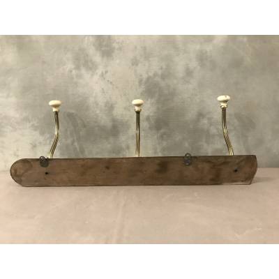 Brass and ceramic coat rack bar from the late 19th century