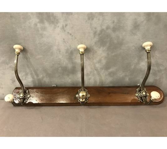 Brass and ceramic coat rack bar from the late 19th century