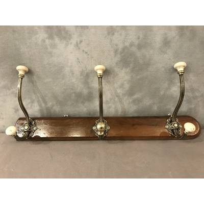 Brass and ceramic coat rack bar from the late 19th century