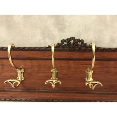 Set of 6 coat racks, bronze coat hooks on wood from the 19th century