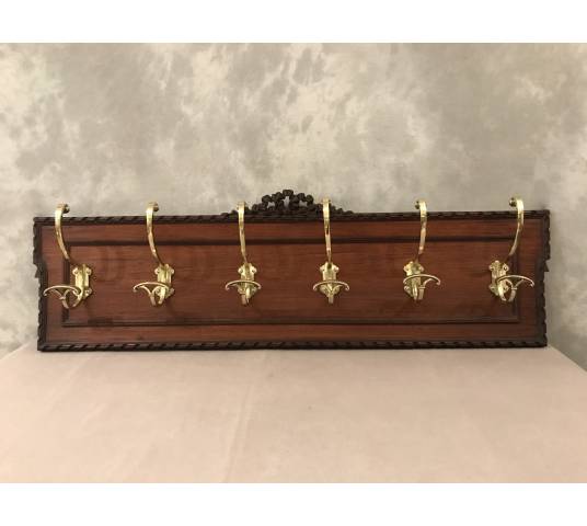 Set of 6 coat racks, bronze coat hooks on wood from the 19th century