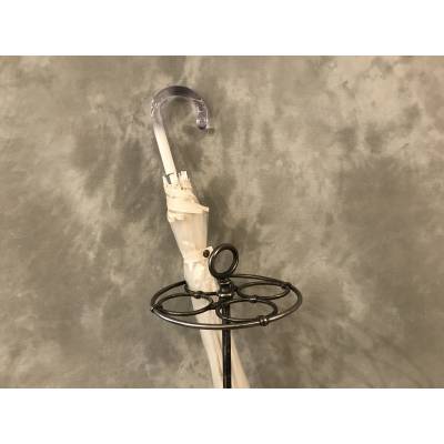 Old round cast iron umbrella stand from the late 19th century